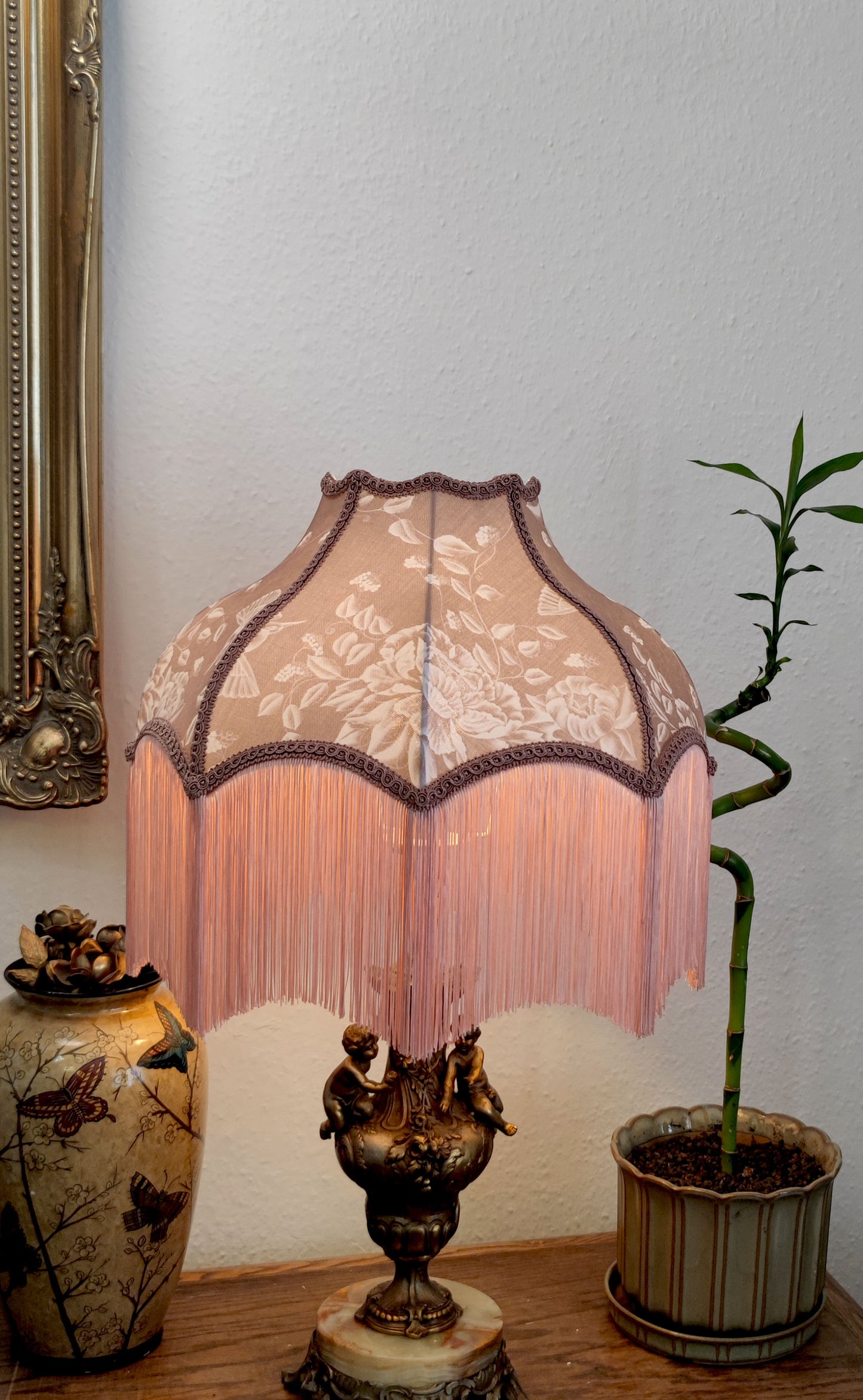 Chinoiserie-style lampshade fringed in blush
