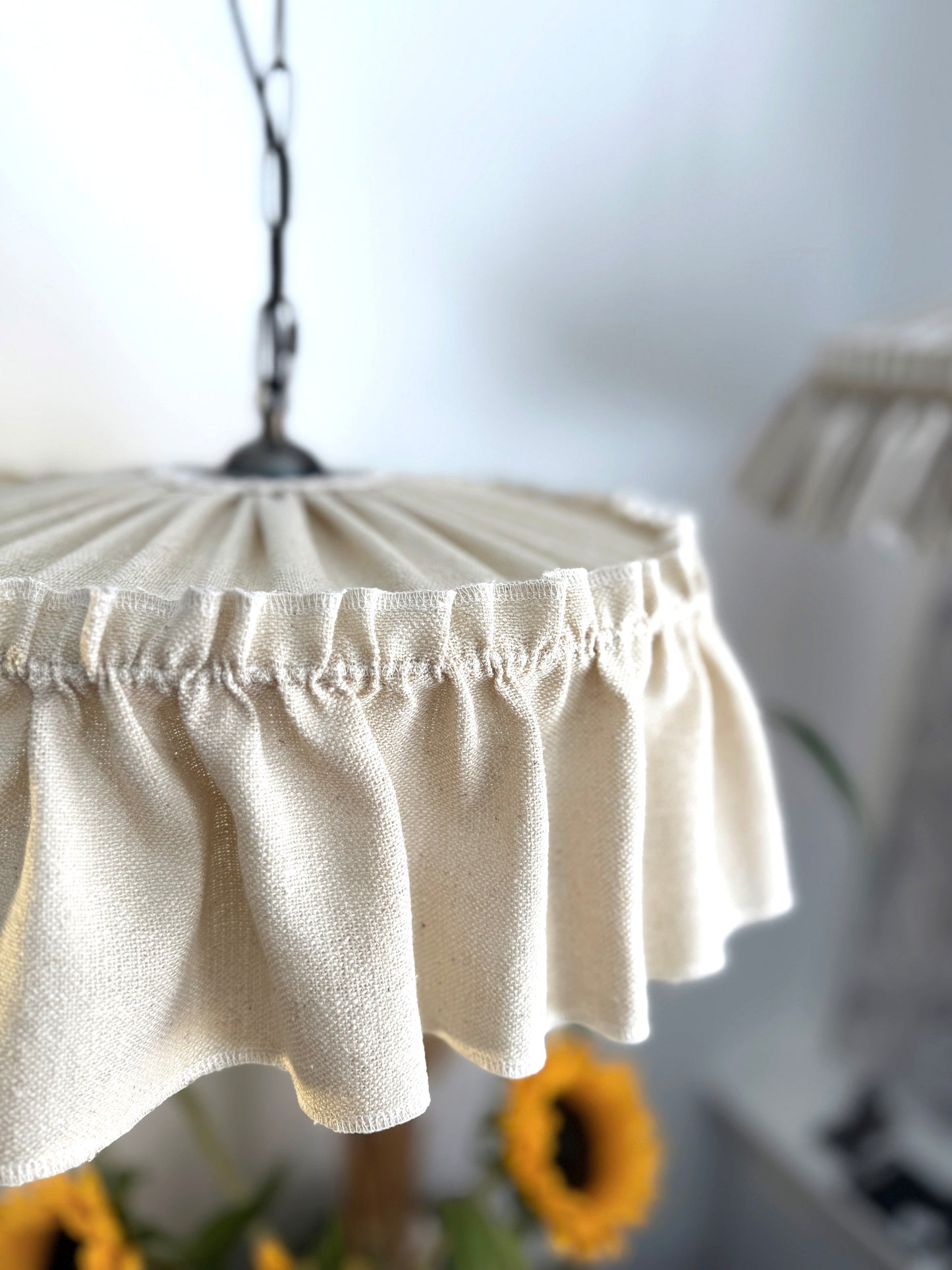 Close-up of an oatmeal ruffle-trimmed, raw silk