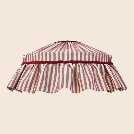Striped lampshade with a red and white pattern on a beige background