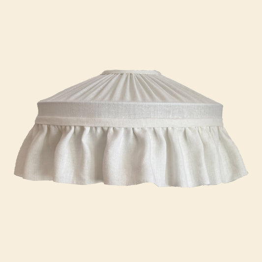 White pleated skirt lampshade on a beige background | House of the soft light