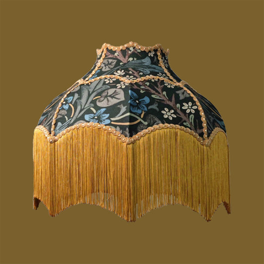 Decorative lampshade with William Morris Blackthorn patterns and gold fringe on a brown background
