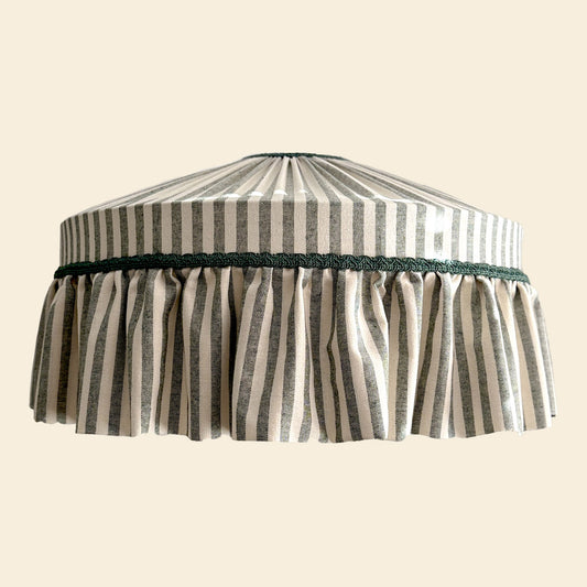 Striped green lampshade with a beige background