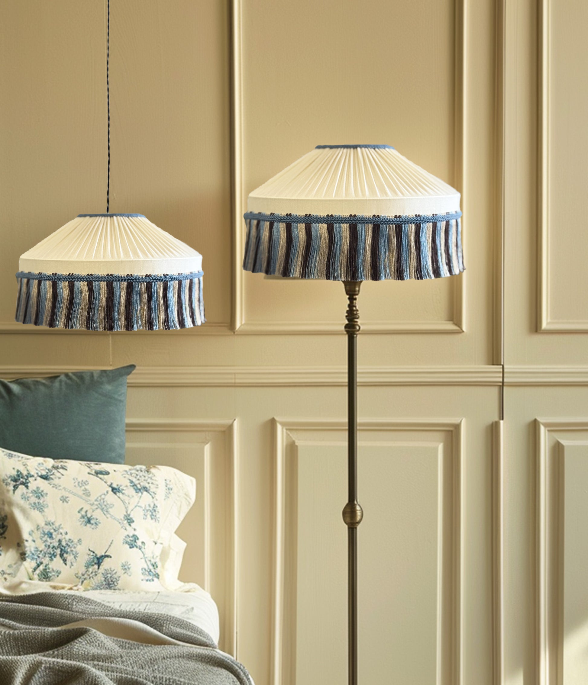 Decorative lamp with pleated shade and blue trim against a beige paneled wall.
