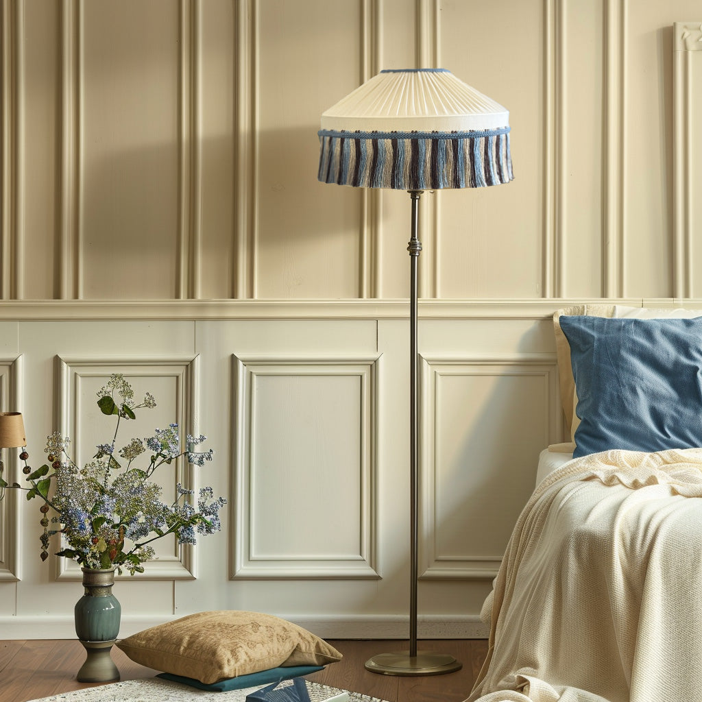 Decorative floor lamp with pleated shade in a bedroom setting.
